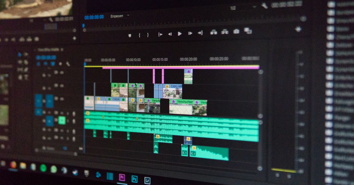 Close-up of a video editing timeline on a computer screen, showing clips and audio waveforms